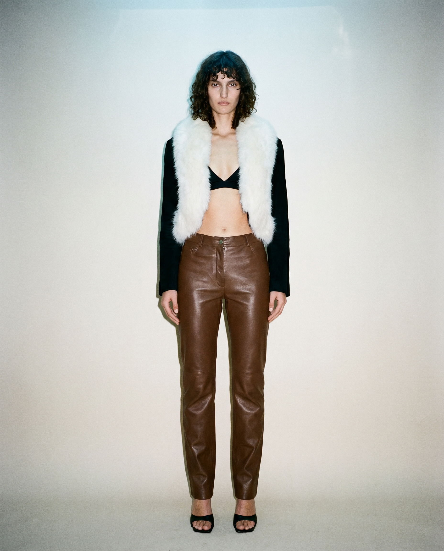 Vintage Loris Azzaro white fox fur cropped evening jacket with contrasting black sleeves, available for purchase and luxury rental across Europe from Mezzanotte.