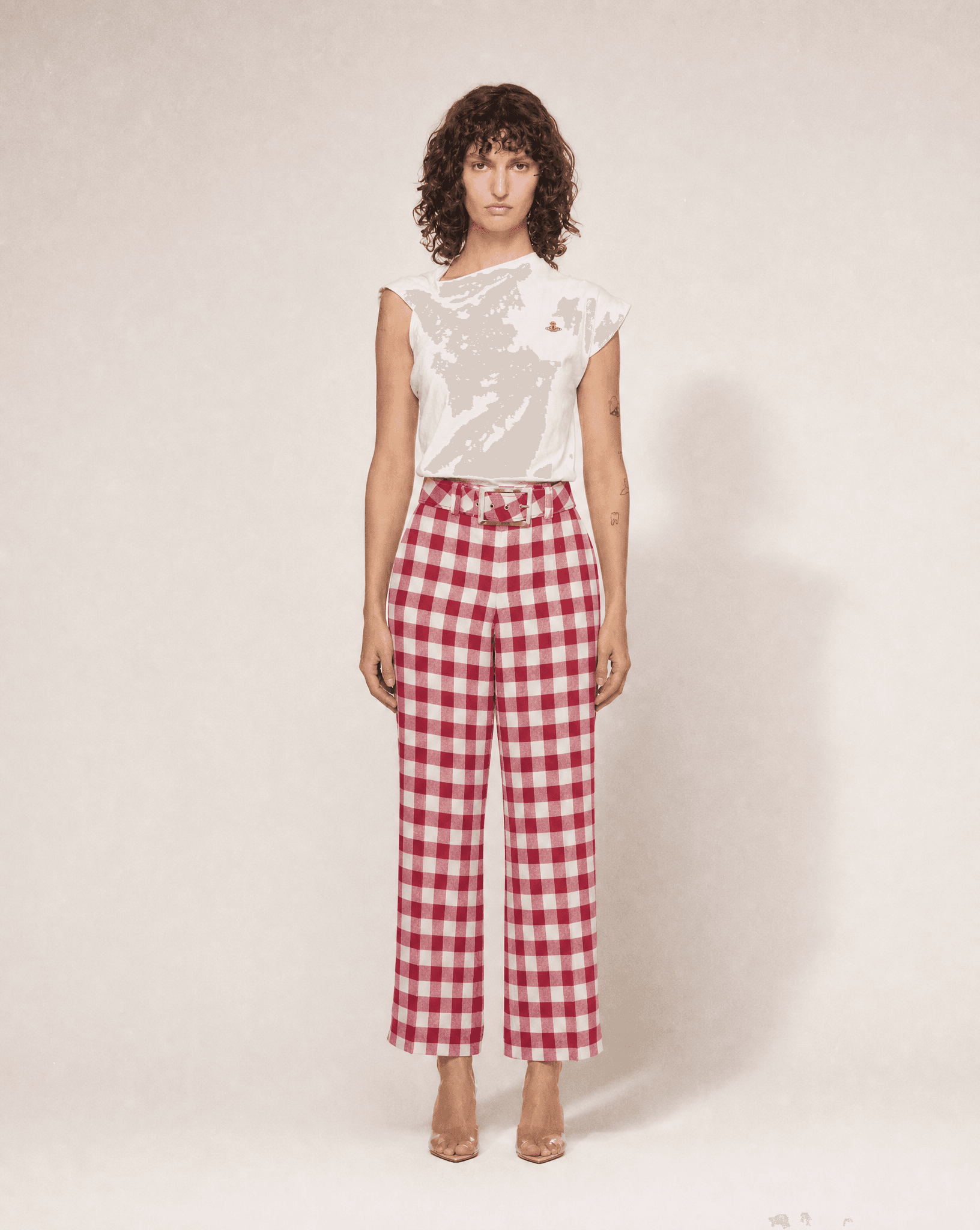 Vintage Moschino red and white gingham high-waisted cotton trousers with statement bow belt, available for purchase and luxury rental across Europe from Mezzanotte.