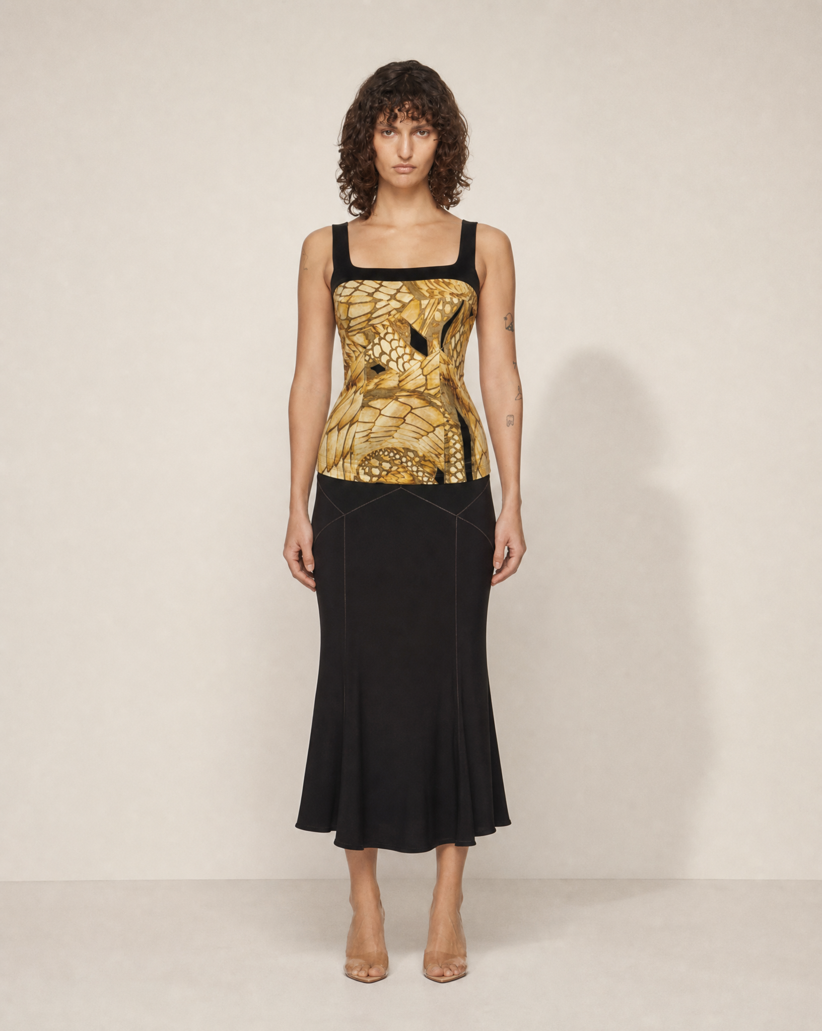 Vintage Roberto Cavalli three-piece skirt suit featuring a matching animal print corset top, tailored blazer and black flared skirt, available for purchase and luxury rental across Europe from Mezzanotte.