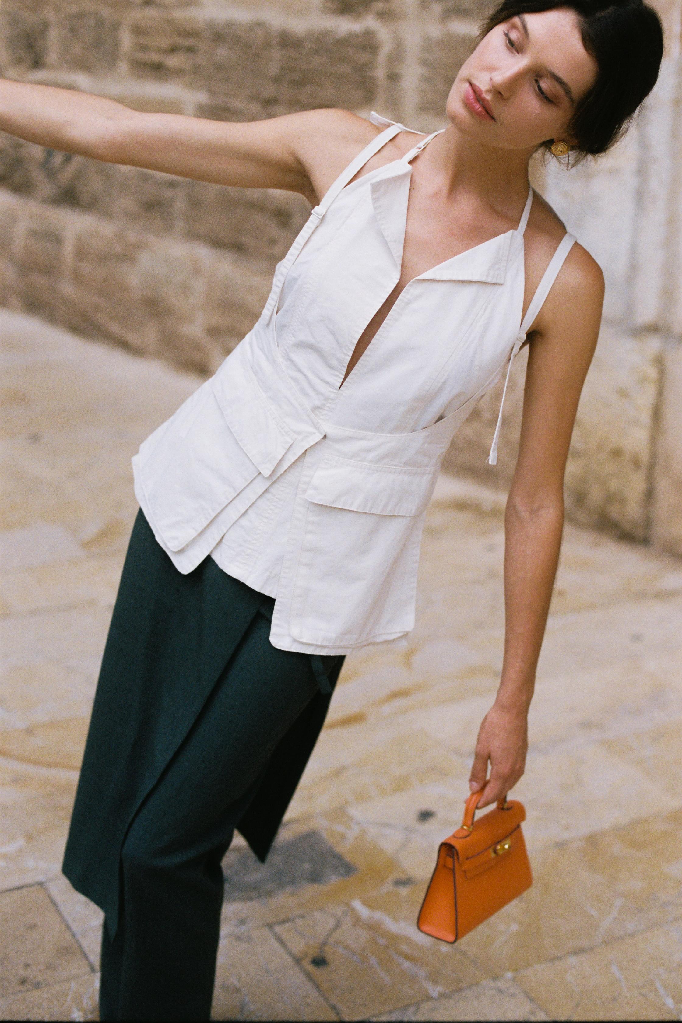 Minimalist skirt-over-pants trousers with buckle strap detail