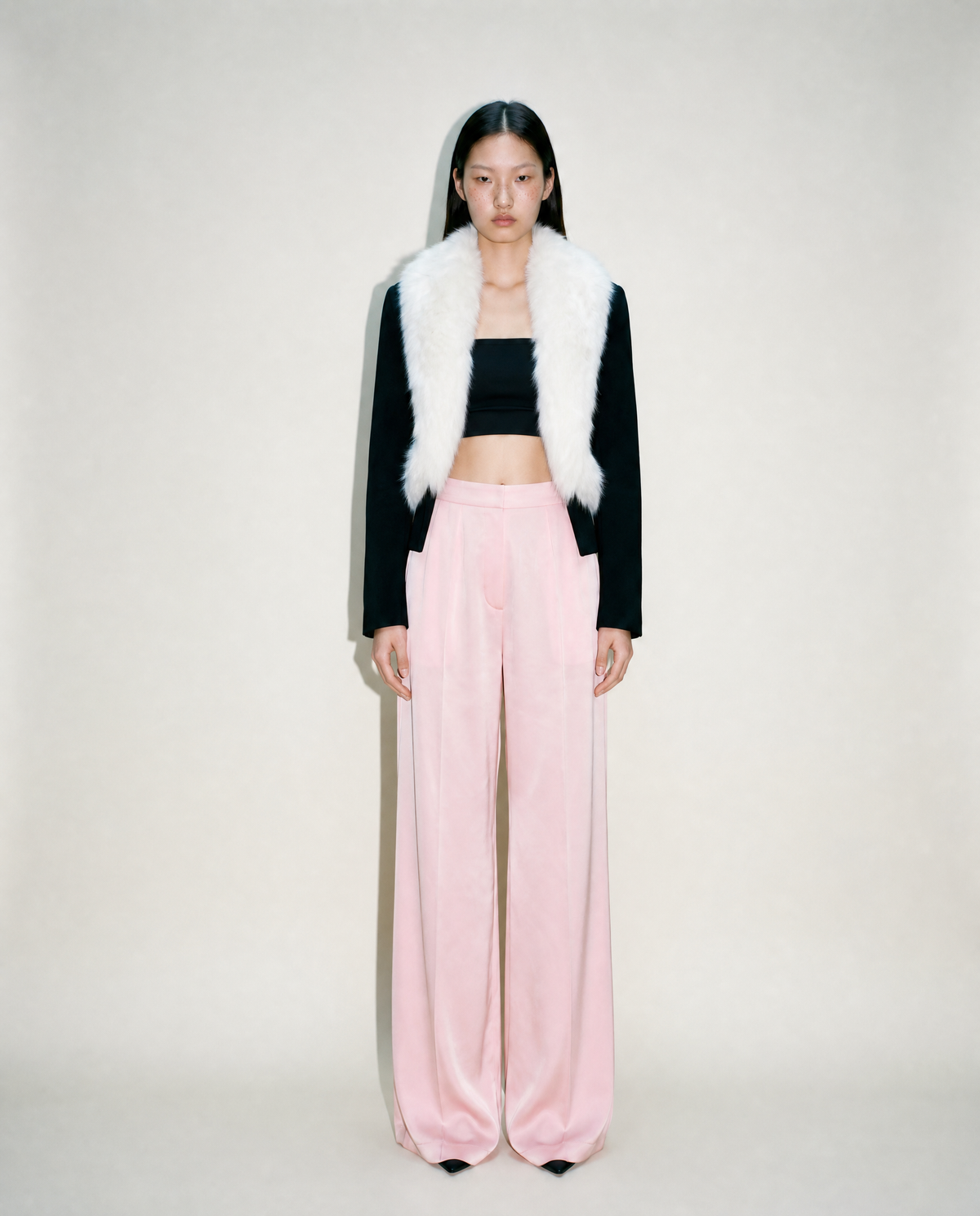 Shop this vintage Loris Azzaro cropped evening jacket at Mezzanotte Vintage. The 1990s design pairs a white fox fur front with fitted black sleeves for a striking contrast.