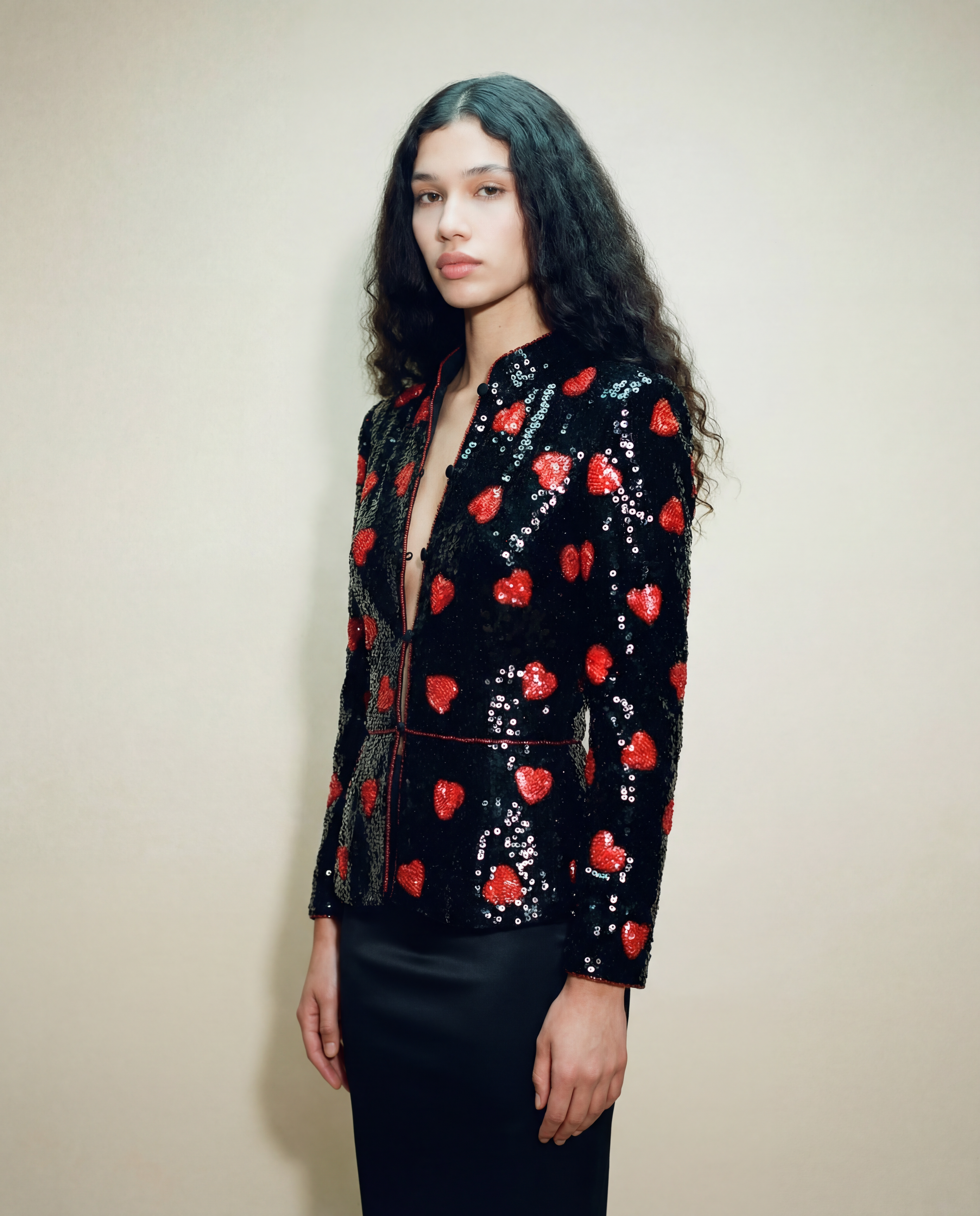 Archival Loris Azzaro sequin blazer with structured shoulders and graphic heart design
