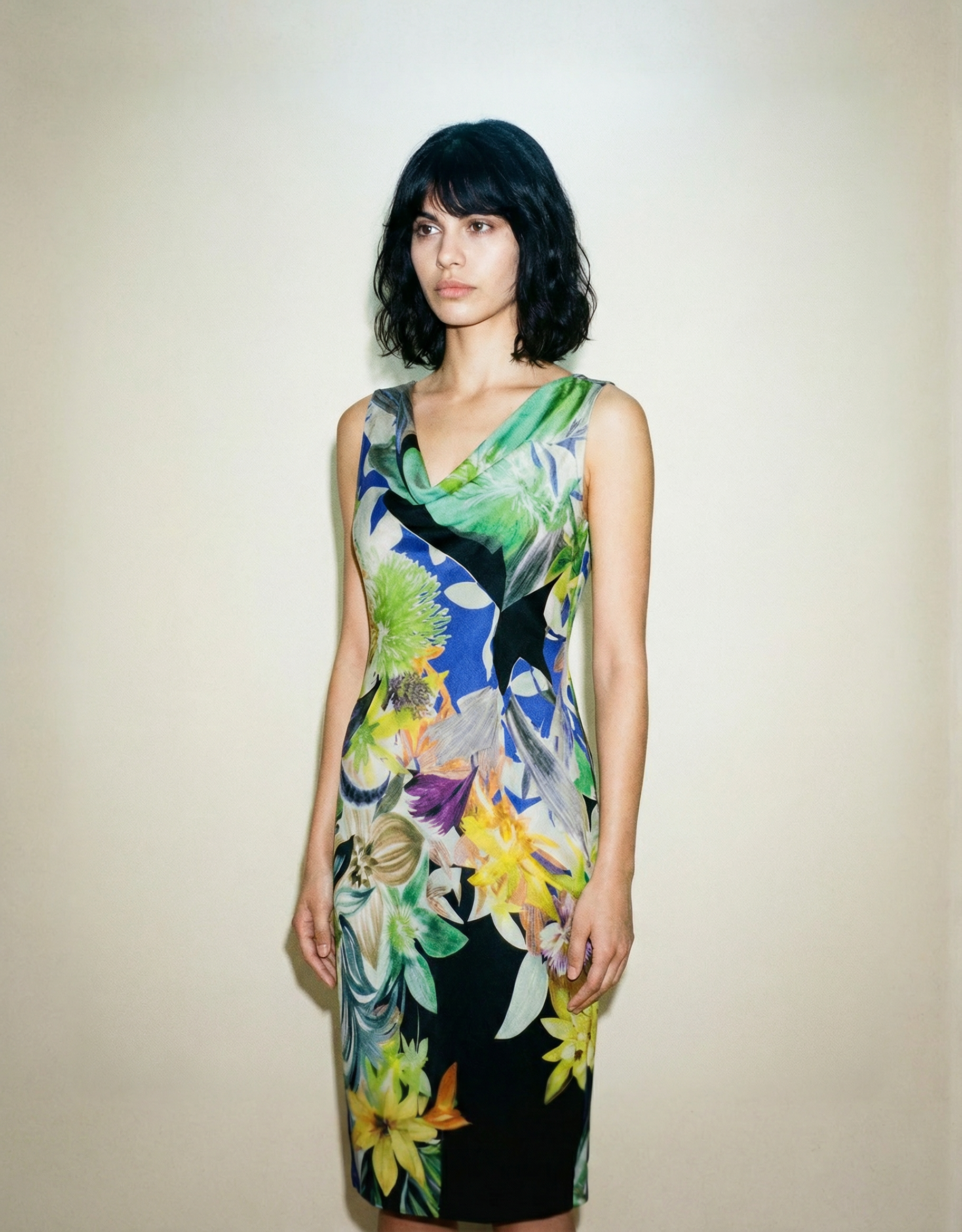 Cassani designer dress with bold floral print and soft draped neckline Madrid
