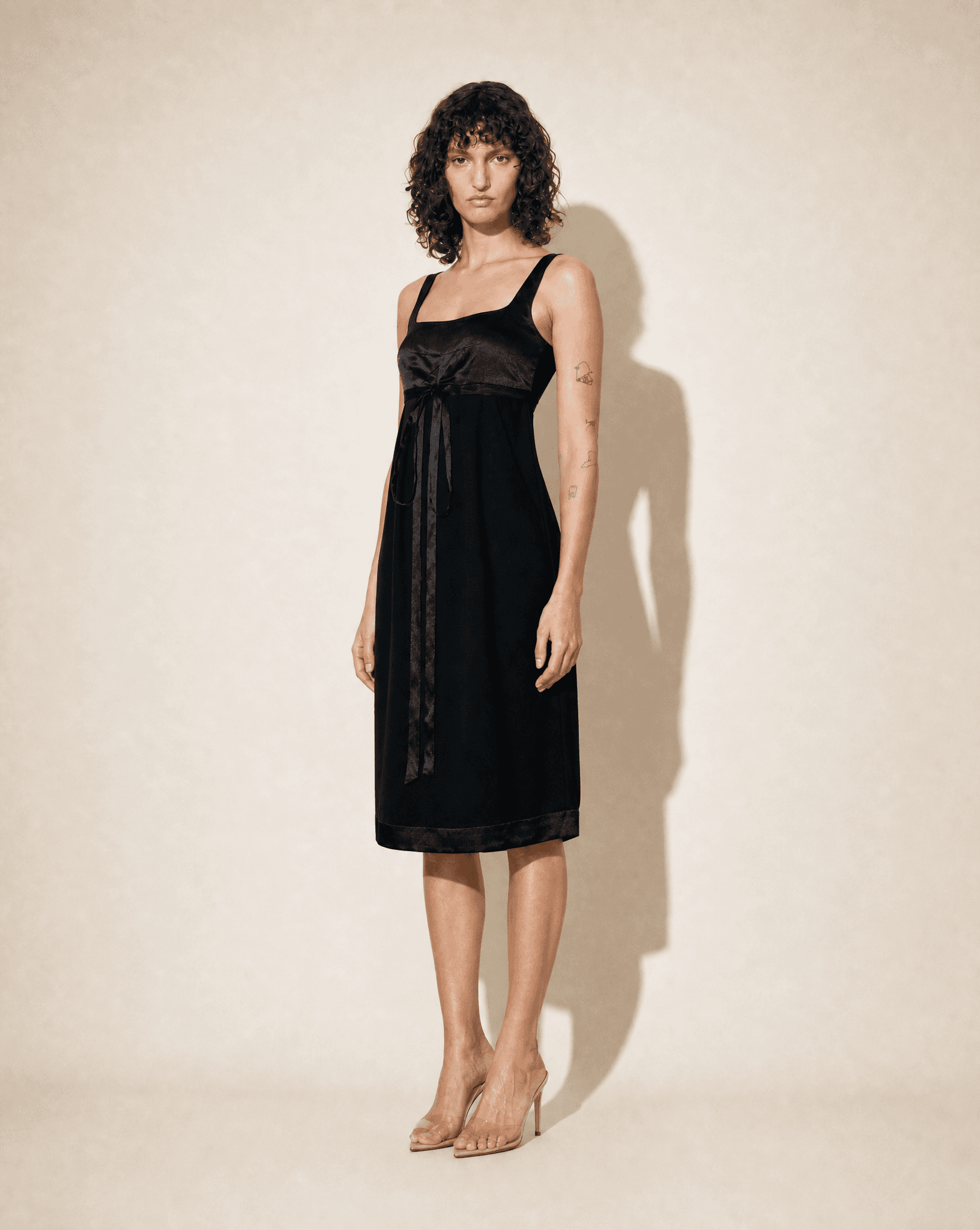 Full-length view of the archival Chanel Little Black Dress showcasing its timeless knee-length proportions and Karl Lagerfeld's refined tailoring.
