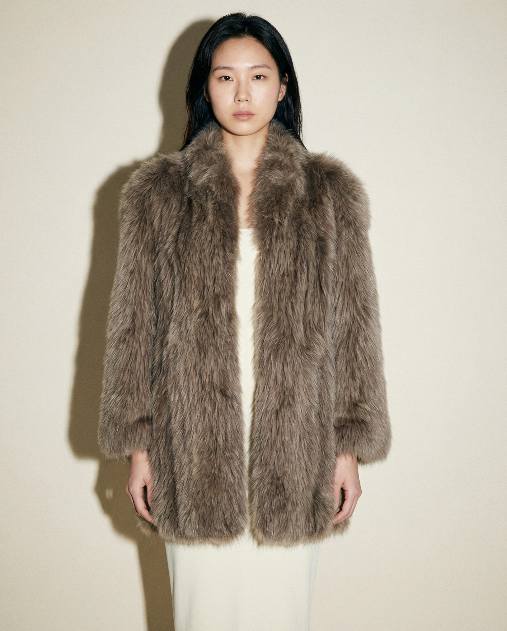 Vintage long hair fur coat in taupe grey with oversized silhouette and plush texture Mezzanotte Madrid
