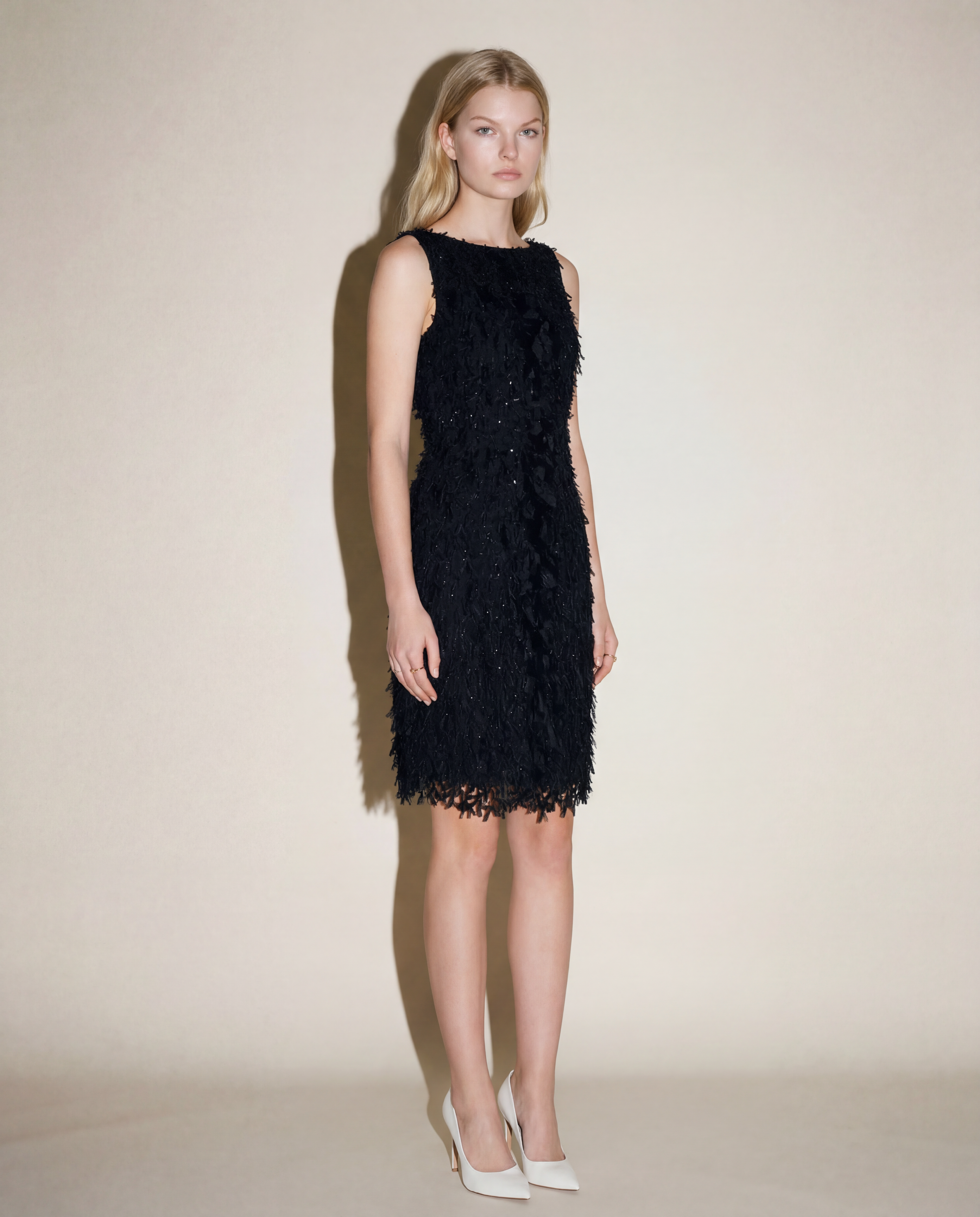 Oscar de la Renta evening dress with rich appliqué surface and elegant straight cut