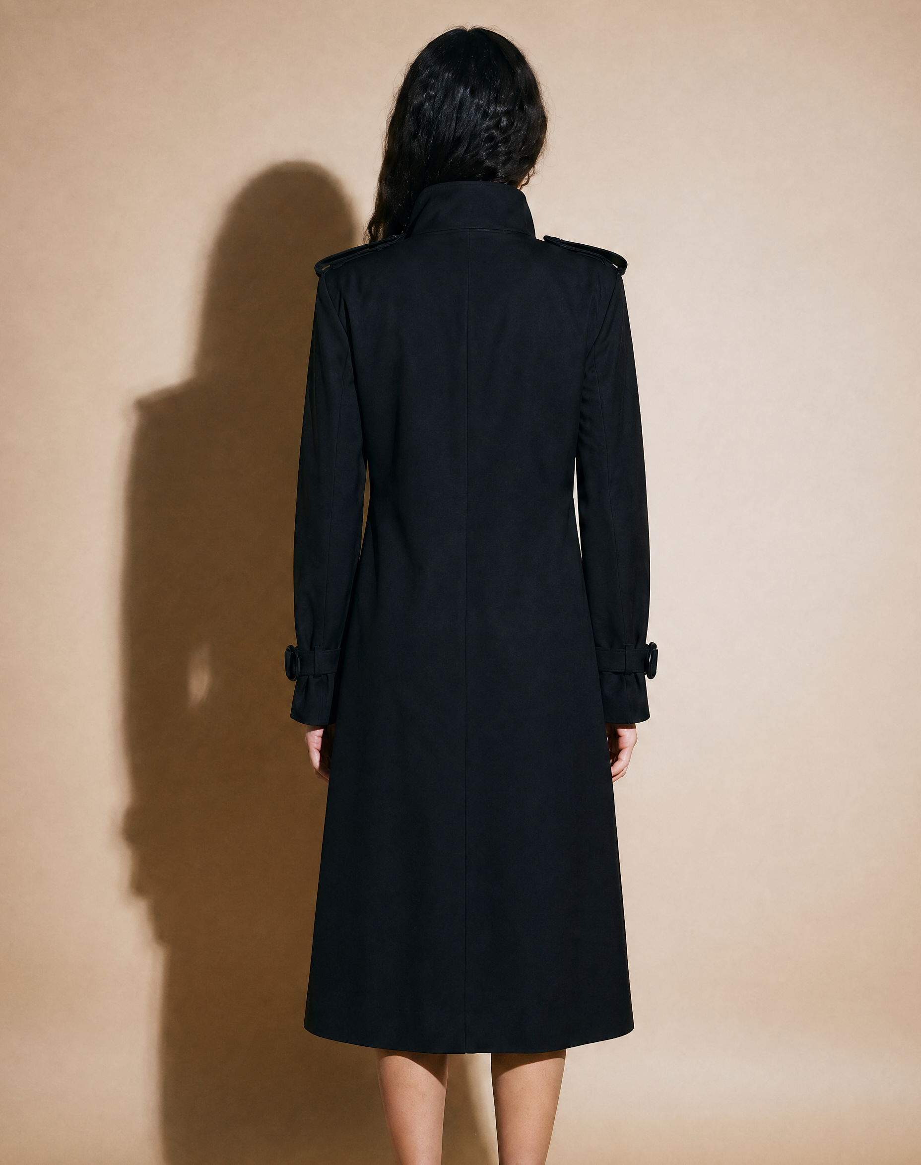 Black military trench coat with integrated belt details
