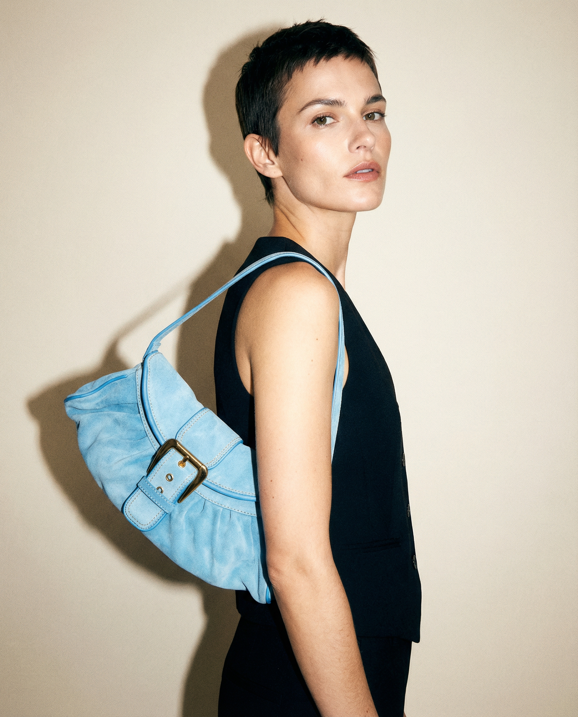 Celine vintage light blue suede shoulder bag with buckle detail and ruched silhouette | designer bag Mezzanotte Madrid rental and sale