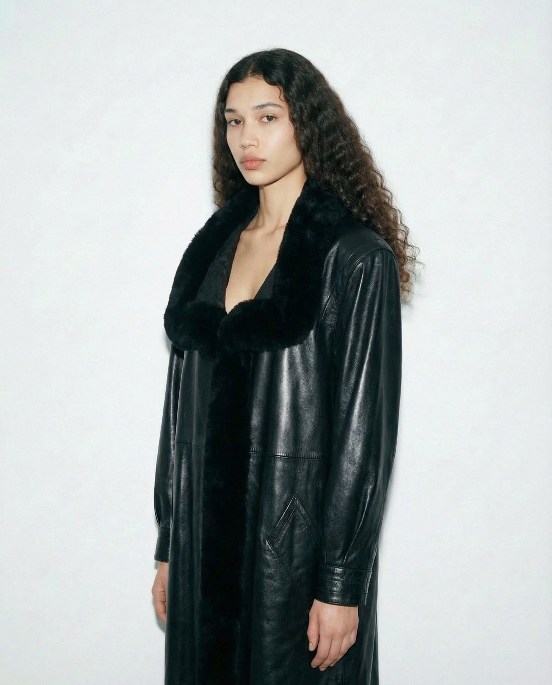 Vintage Yves Saint Laurent leather and fur coat with elongated cut | luxury winter coat Mezzanotte Madrid