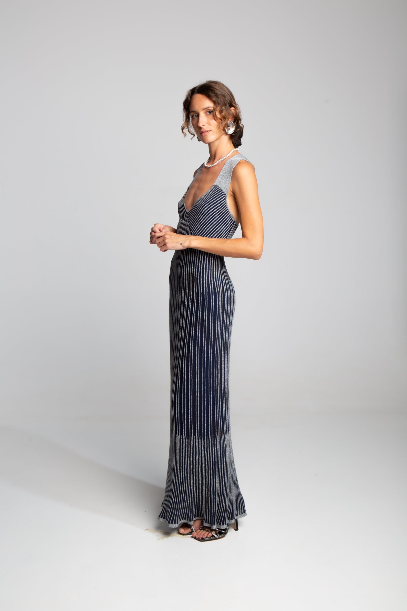 Metallic striped evening dress with body-contouring fit