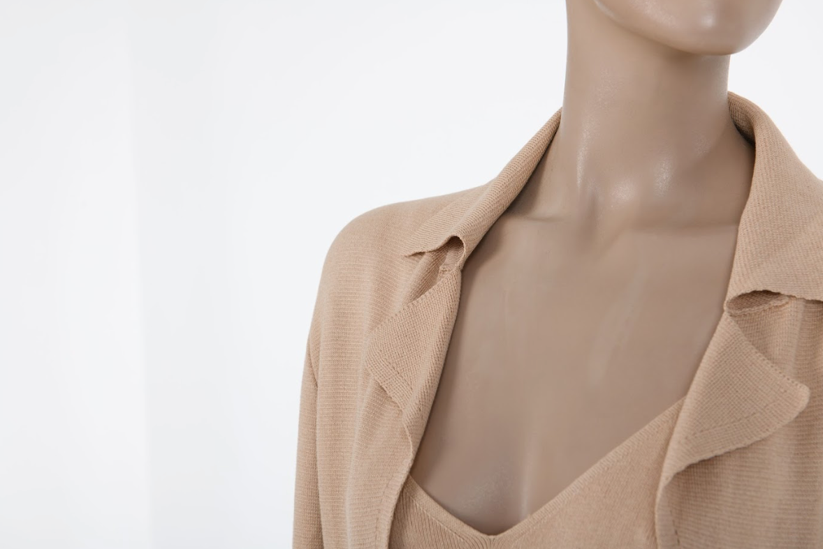 Close-up of the Malo knit set highlighting the intricate vertical wave-knit texture and the luxurious sheen of the silk-blend fabric.