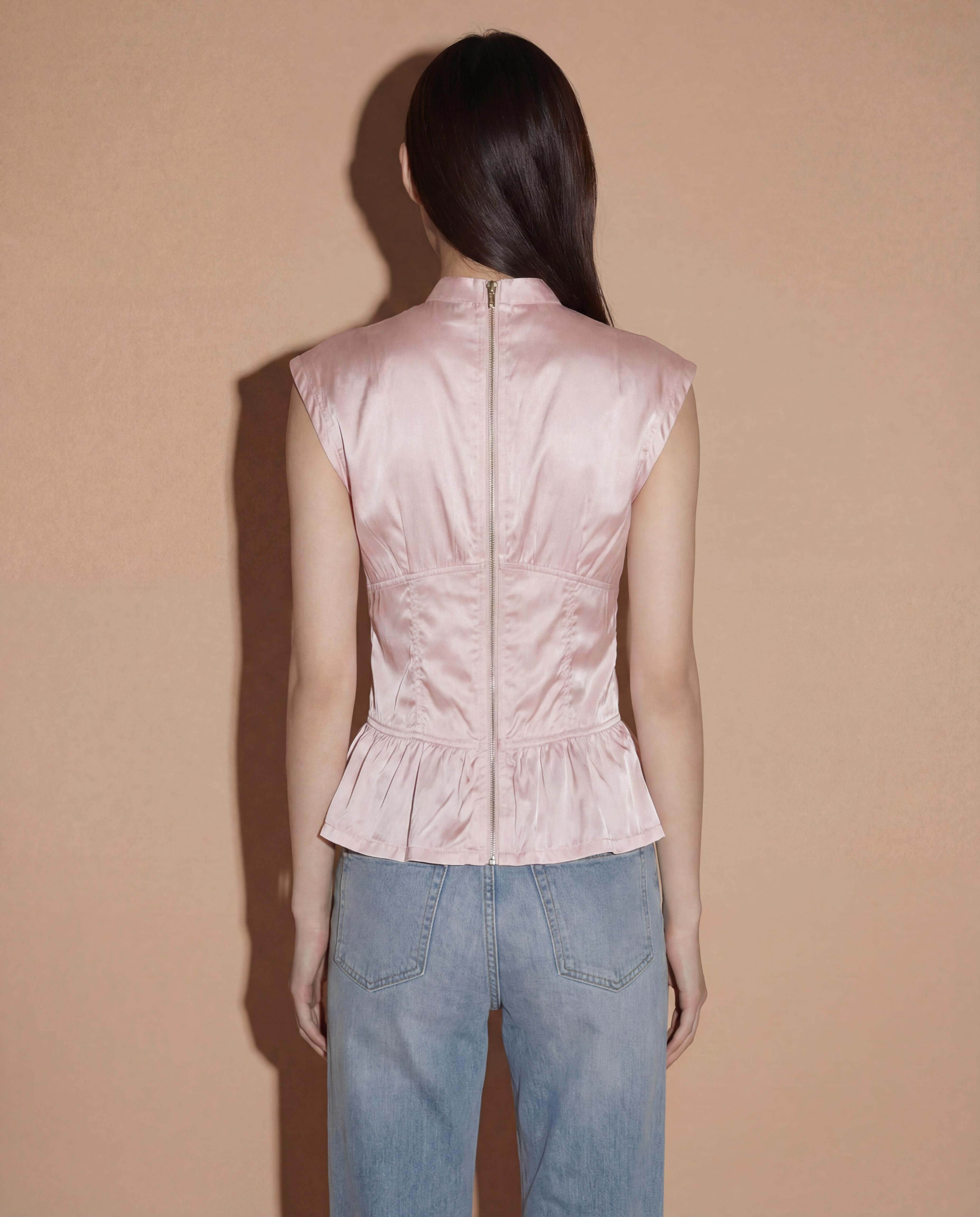 Back view of the Prada Sport corset-style top highlighting the iconic lace-up detailing for an adjustable cinched waist.