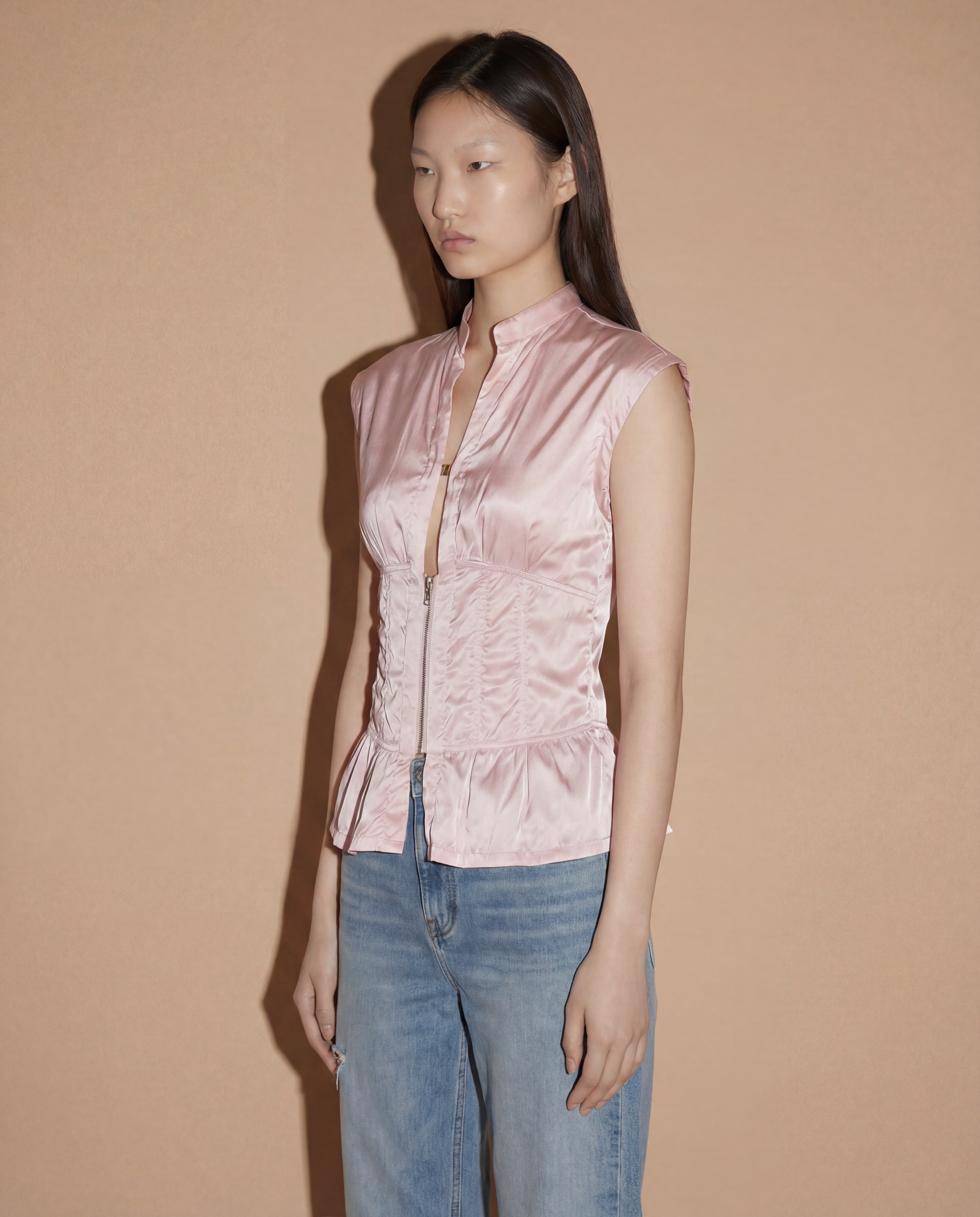 Side profile of the Prada Sport corset-style top showcasing the sculptural hourglass fit and industrial Linea Rossa design.