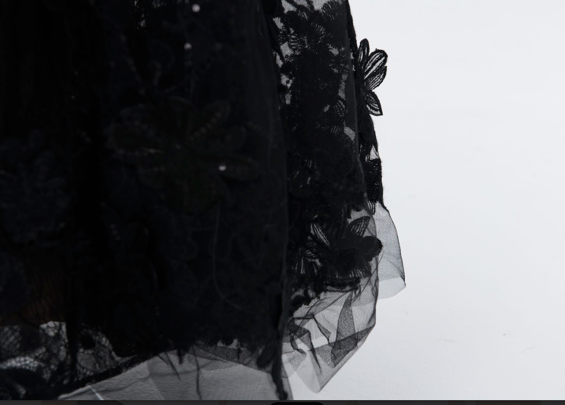 Designer black evening dress with intricate lace and subtle sequin embellishment