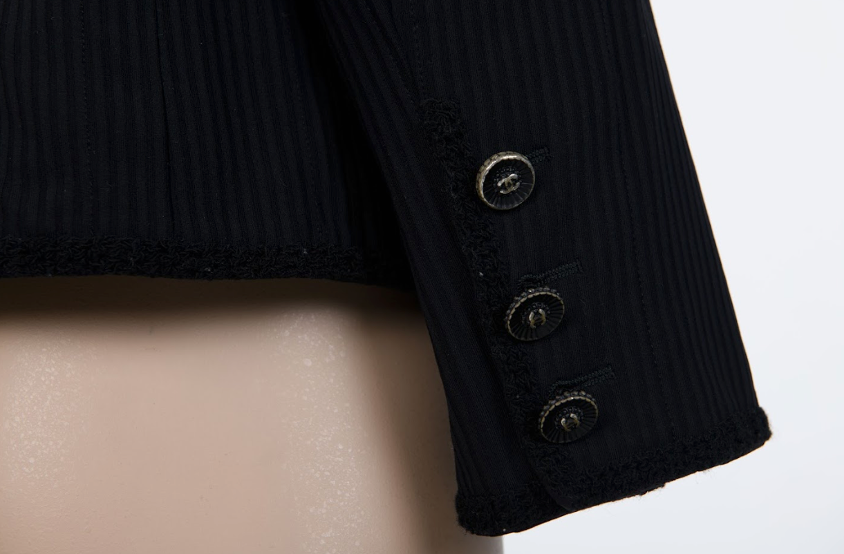 Black Chanel jacket with round neckline and timeless design Mezzanotte Madrid