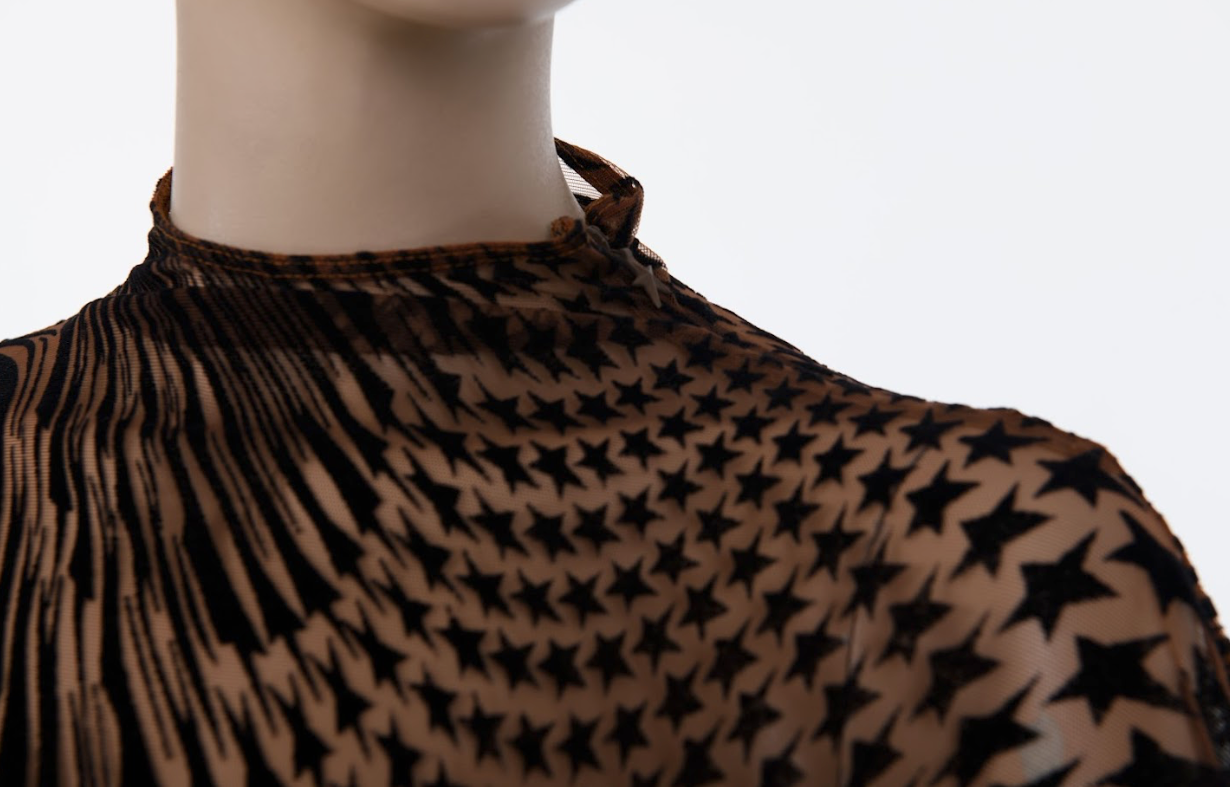 Transparent fitted top with psychedelic star print and high neckline
