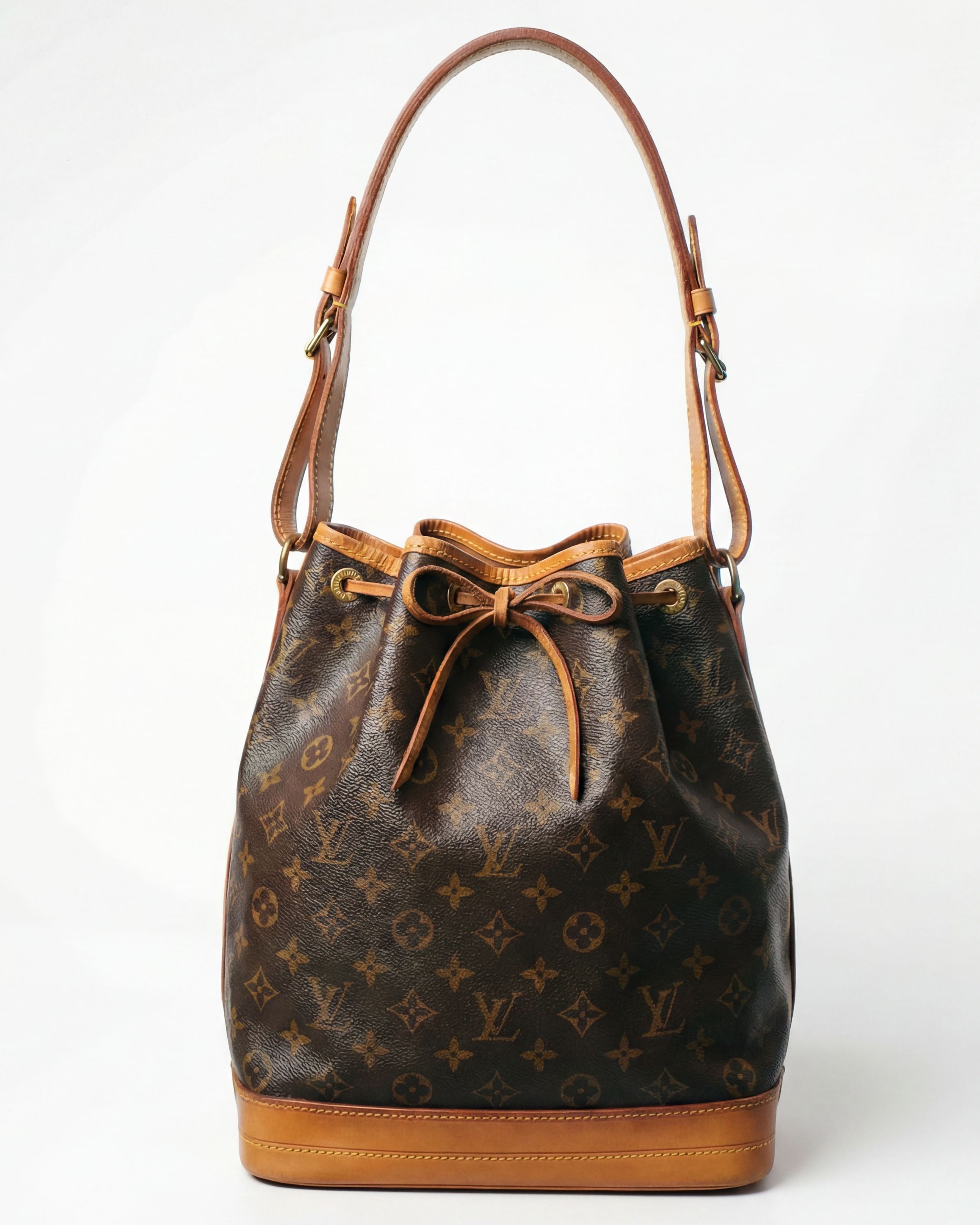 LV monogram drawstring bag with vachetta leather and bucket silhouette