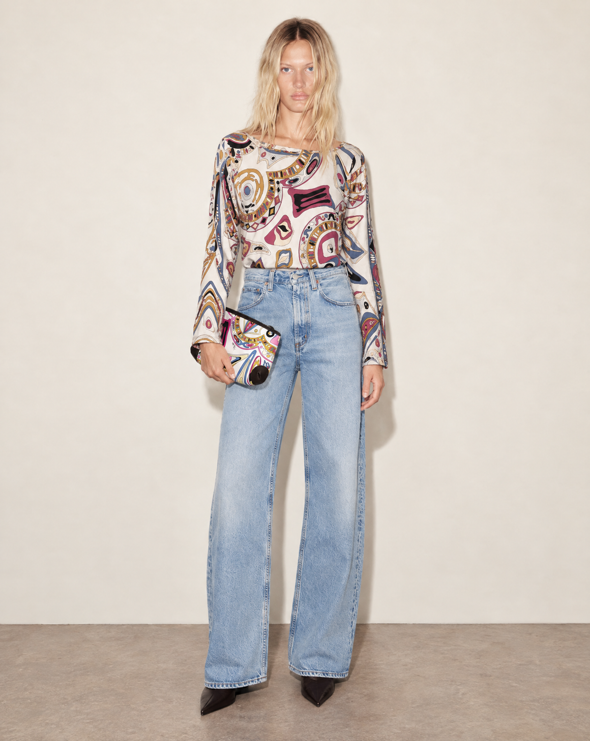 1990s Emilio Pucci set with a multicolour silk jersey top and matching clutch. The coordinated print features fuchsia, navy, olive, ivory, black and blue.