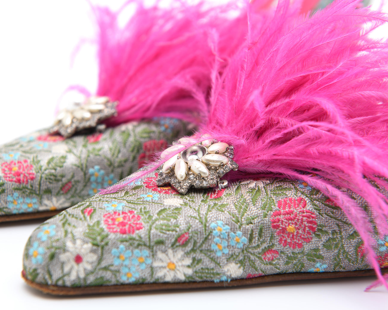 Manolo Blahnik statement feather‑trim brocade heels with jeweled detail — curated designer rental and resale at Mezzanotte Madrid
