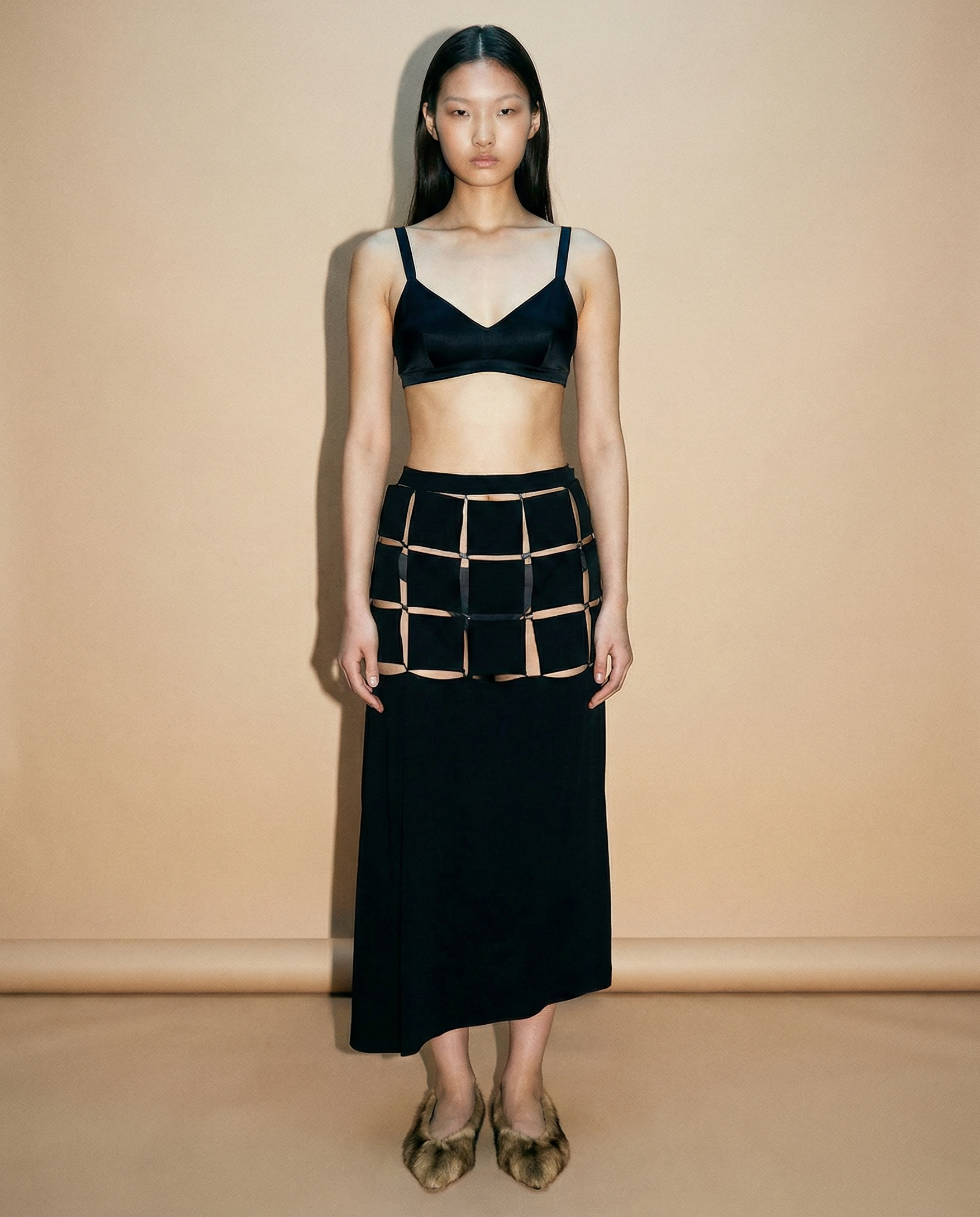 Yohji Yamamoto 2004 black puzzle wrap skirt with architectural cut‑out waist detailing
