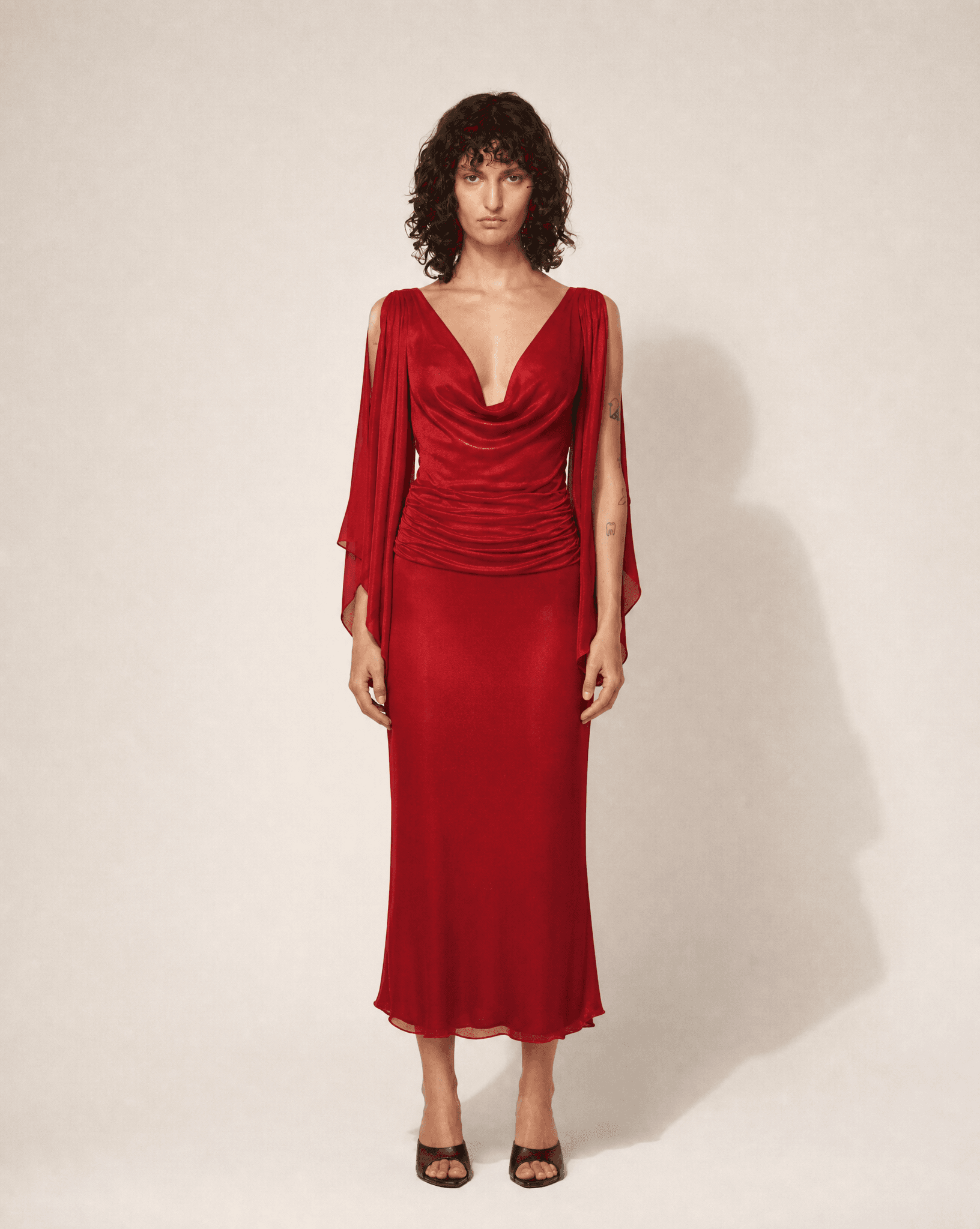 Archival 1990s Valentino draped red gown, available at Mezzanotte Madrid.