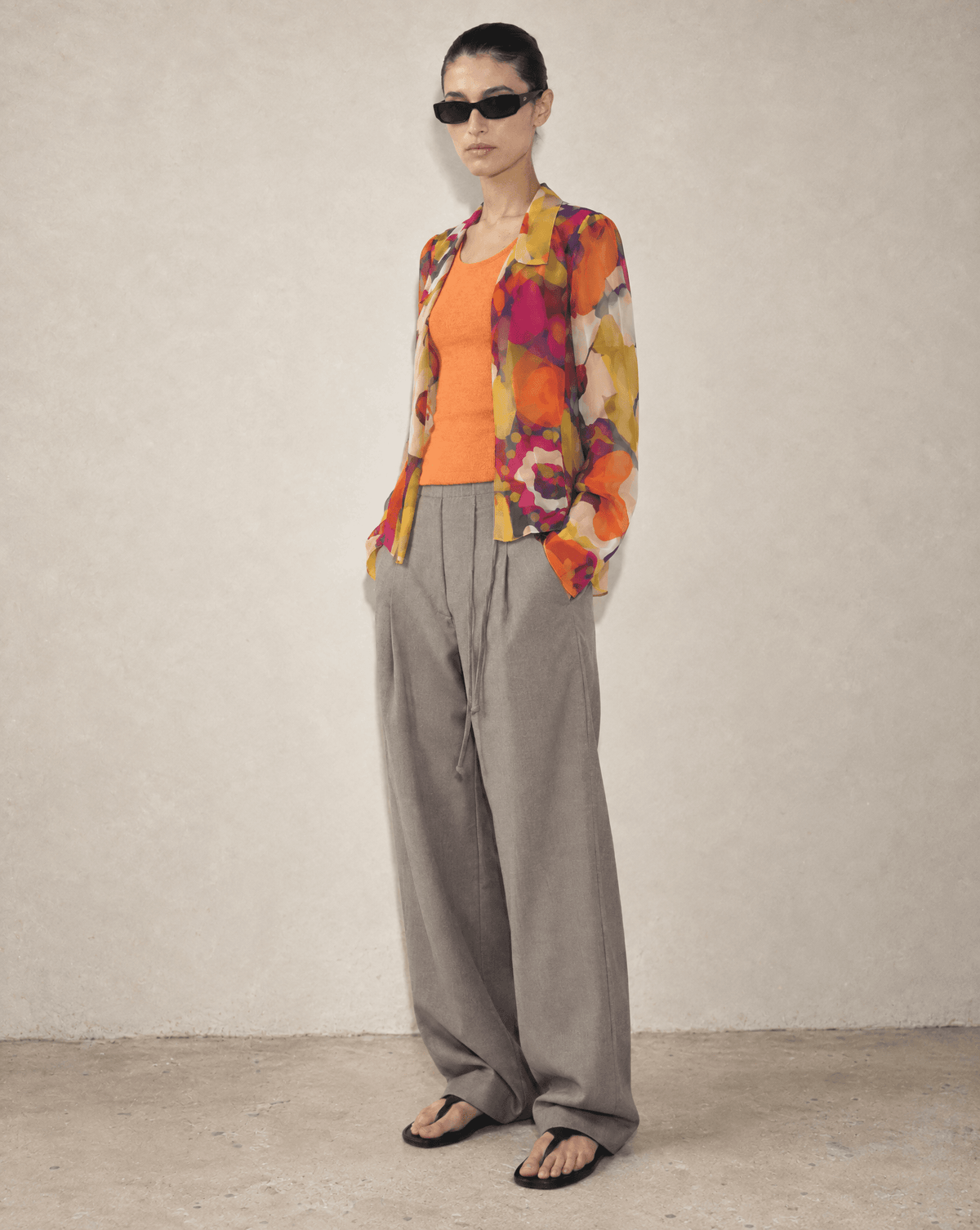 Authentic vintage Chanel Spring Summer 2002 Karl Lagerfeld multicolor silk chiffon floral blouse worn over an orange top Mezzanotte Vintage Archival