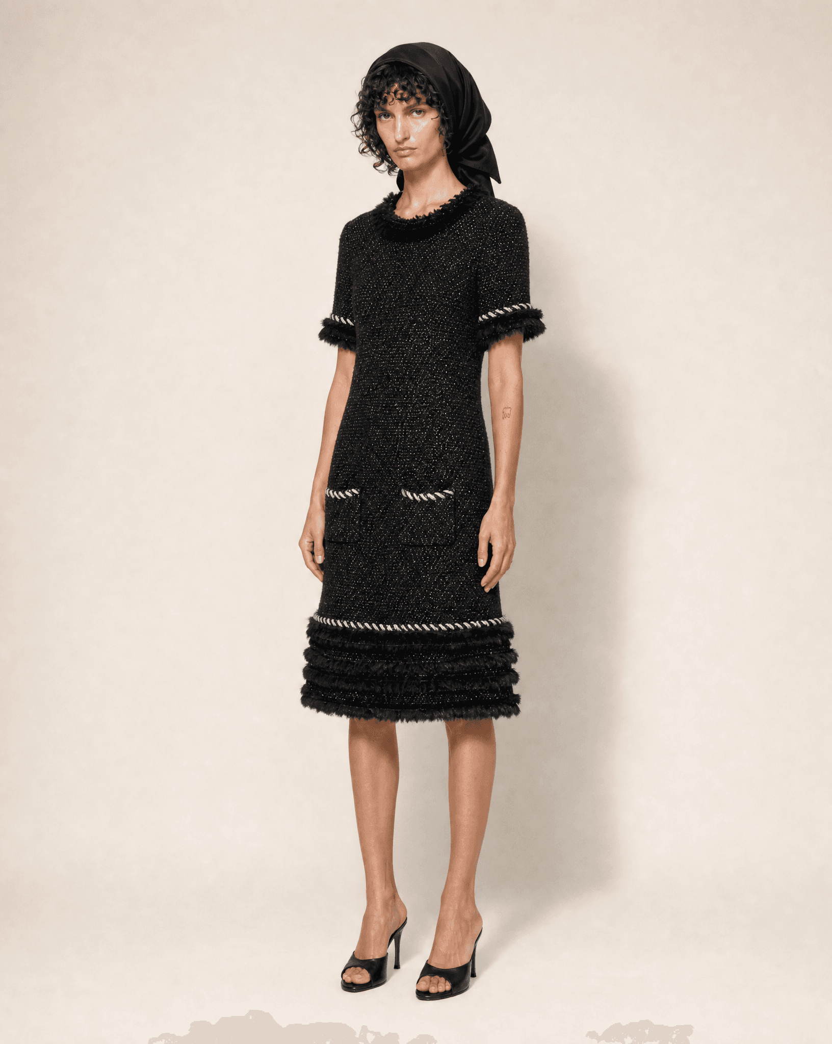Detail view of the intricate trim and cashmere melange texture on Chanel 10A dress.