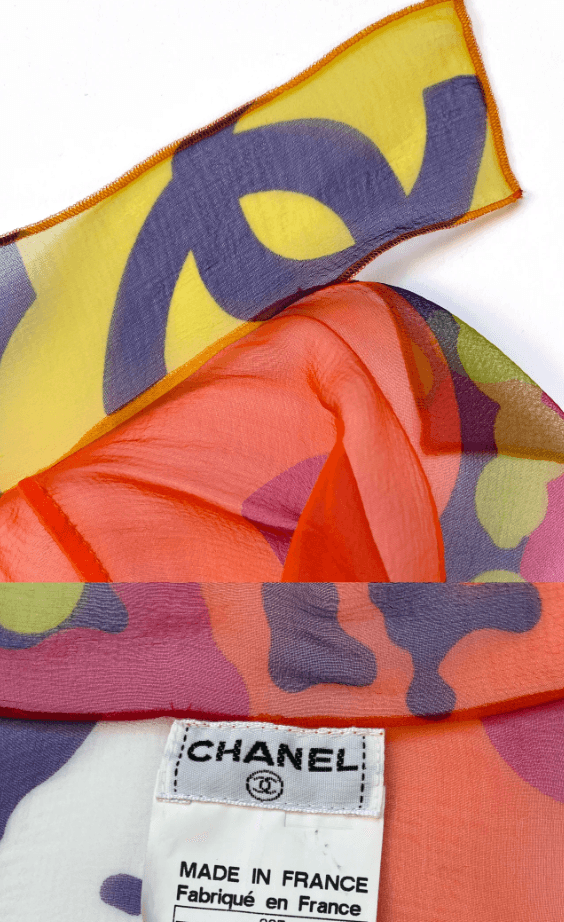 Close-up of the Chanel label on a Karl Lagerfeld era silk chiffon floral blouse. Authenticated by Mezzanotte.