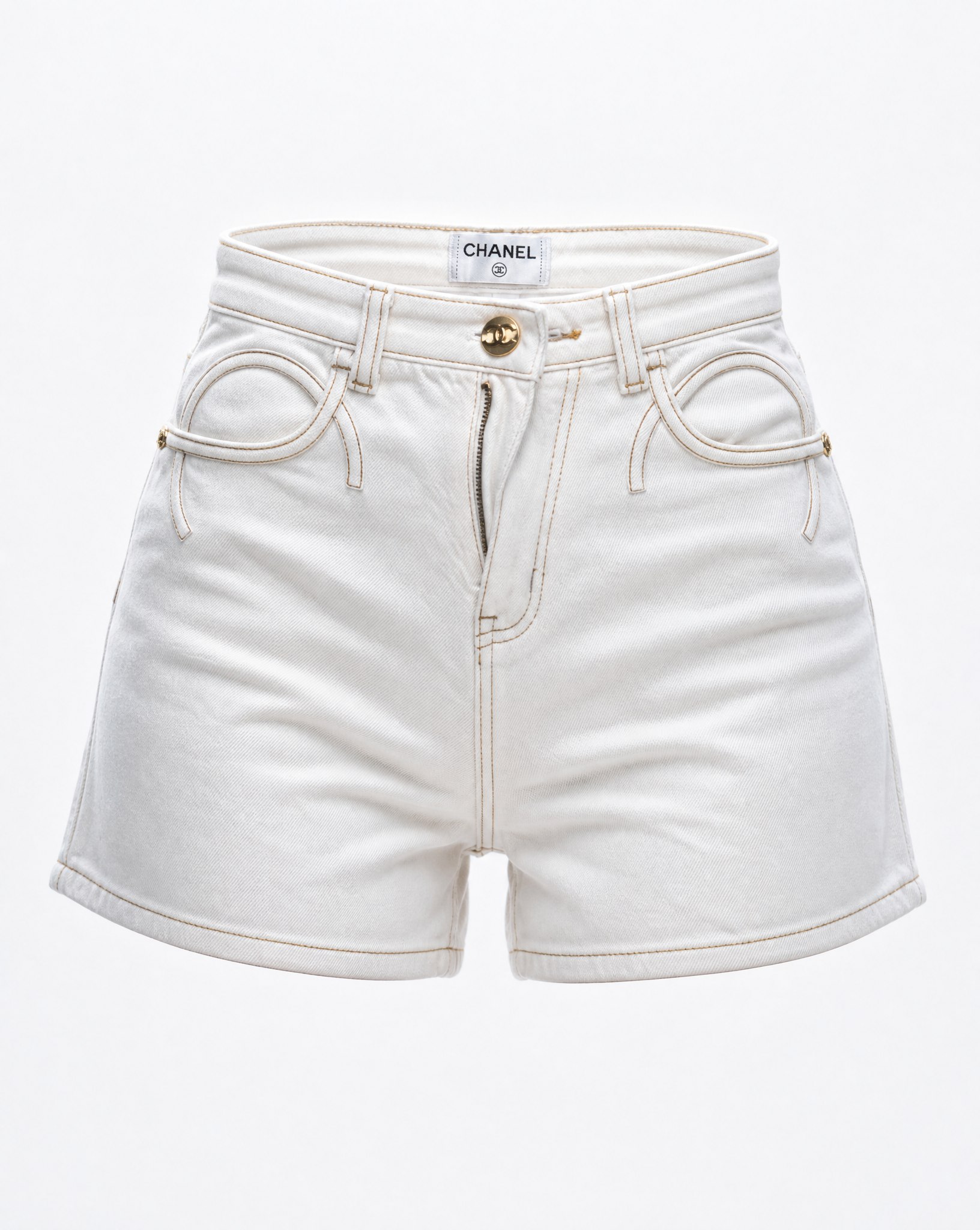 Close-up of the signature interlocking pocket design and gold-tone button on Chanel white denim shorts.