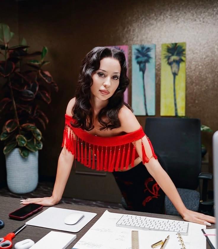 Lis Lopes wearing an archival Dolce & Gabbana early 2000s black fringed silk top. Buy across Europe at Mezzanotte.