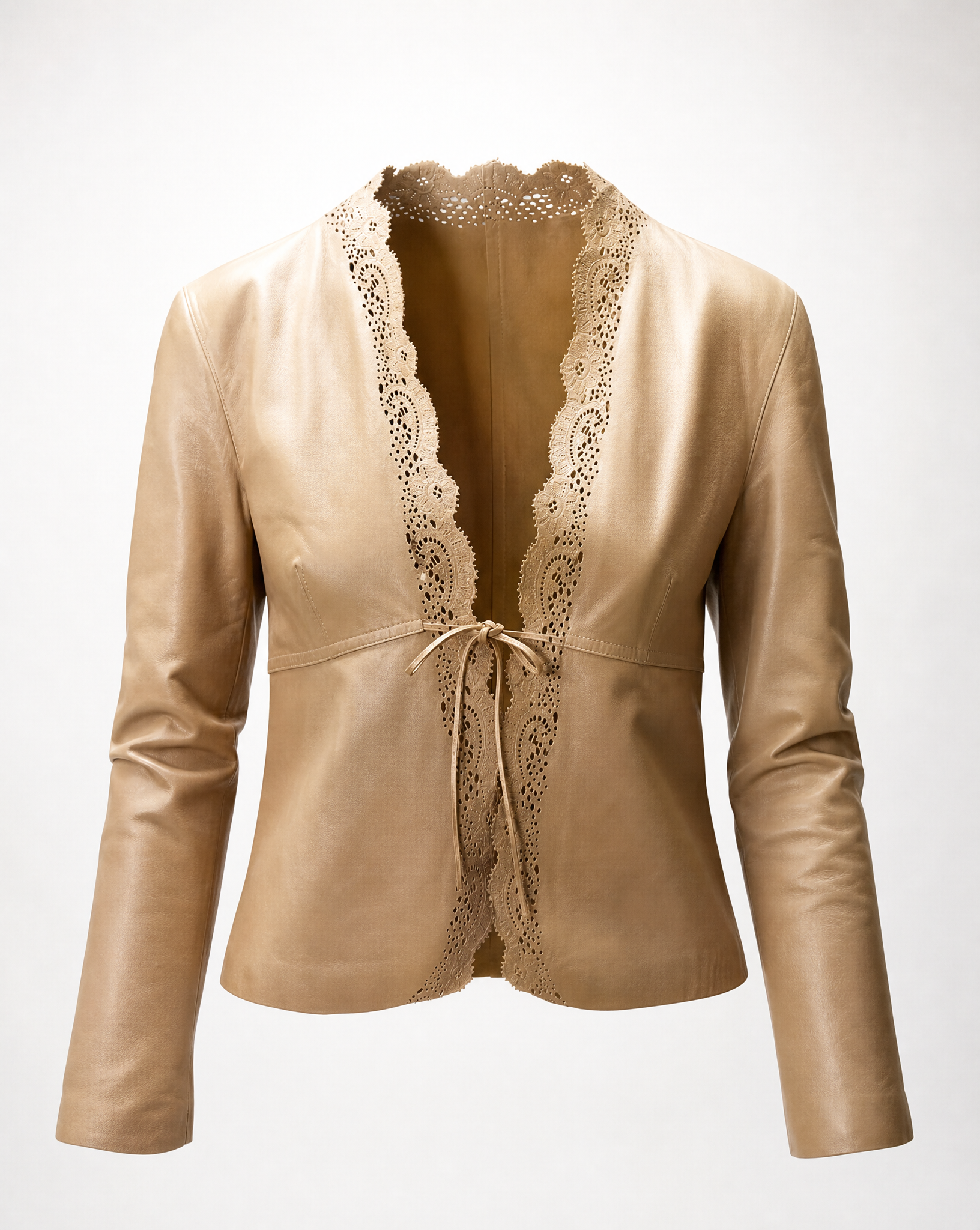 Close-up of the intricate laser-cut leather trim on a vintage Gucci by Tom Ford jacket.
