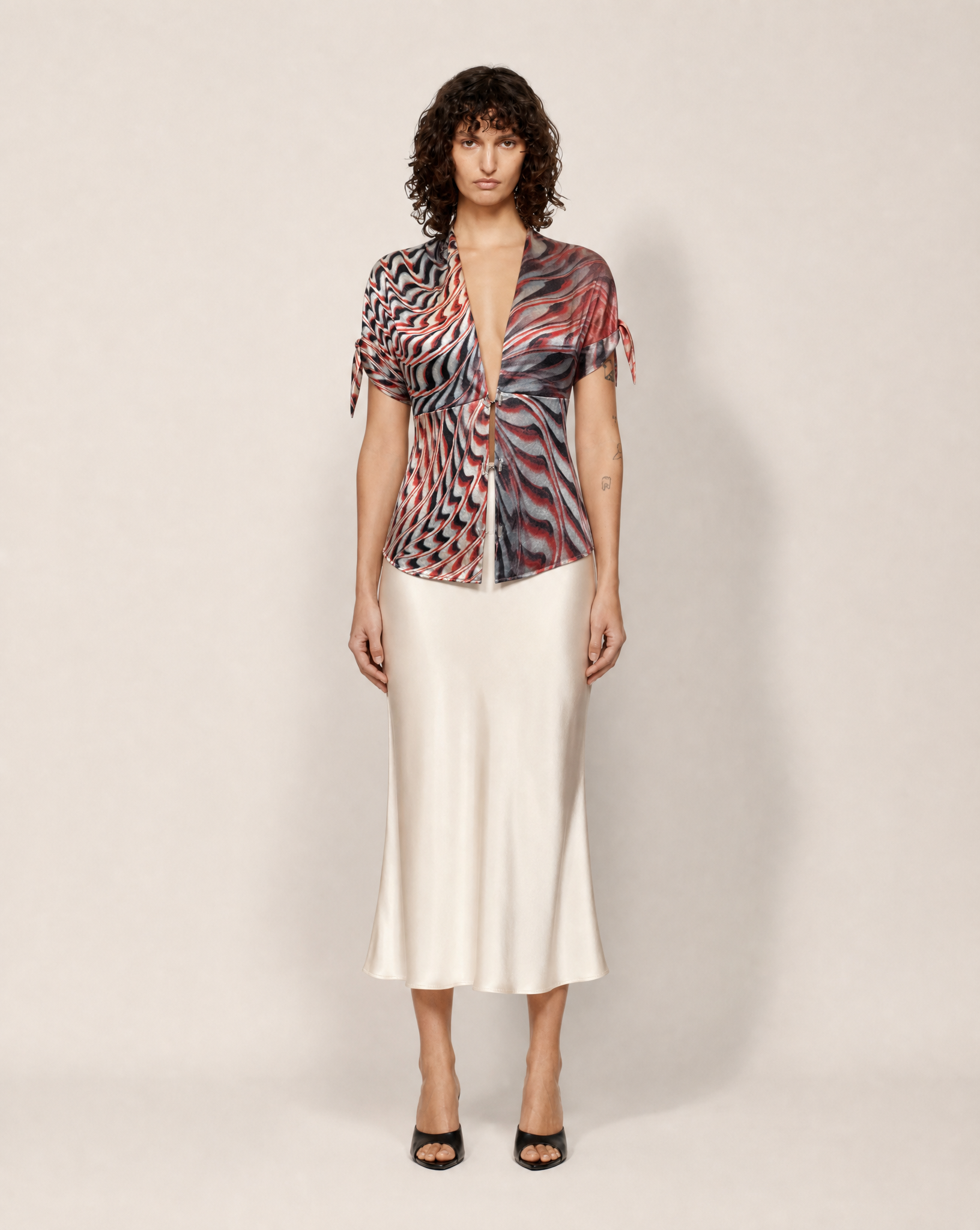 Rare vintage Roberto Cavalli sheer silk shirt with abstract animal-inspired print from the early 2000s, available for authenticated purchase and luxury rental across Europe from Mezzanotte.
