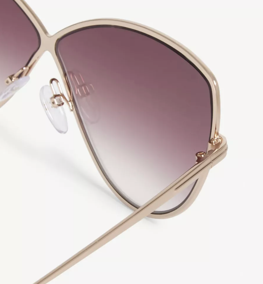 Close-up detail of the metal butterfly frame and pink gradient lenses of the 2026 Tom Ford Elise-02.