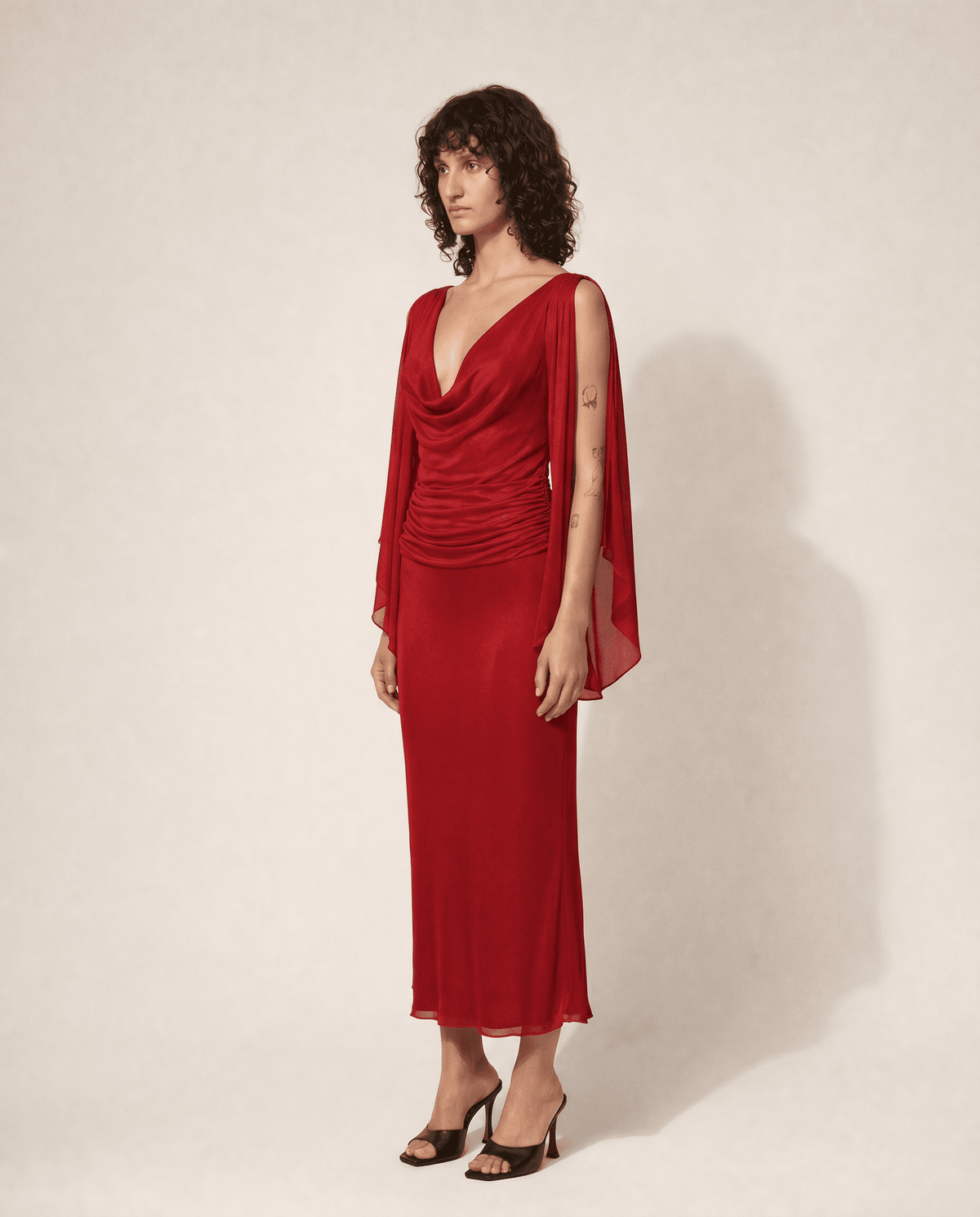 Vintage Valentino Garavani silk chiffon evening gown featuring a draped cowl neckline. Buy across Europe at Mezzanotte.