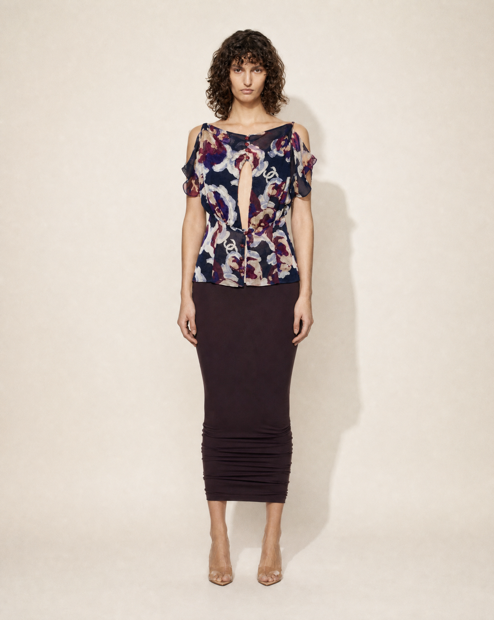 Vintage Chanel silk chiffon floral blouse with subtle CC print, keyhole neckline and cold-shoulder sleeves, available for purchase across Europe from Mezzanotte.