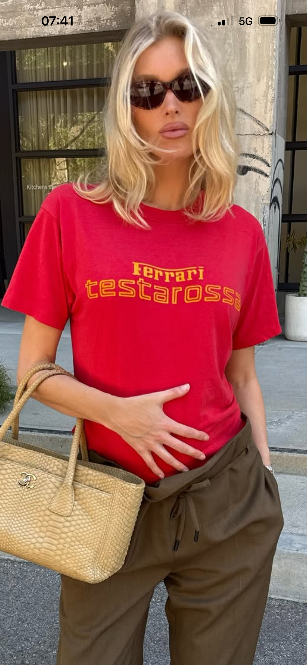 Front view of a vintage Ferrari Testarossa graphic T-shirt with a playful automotive slogan.