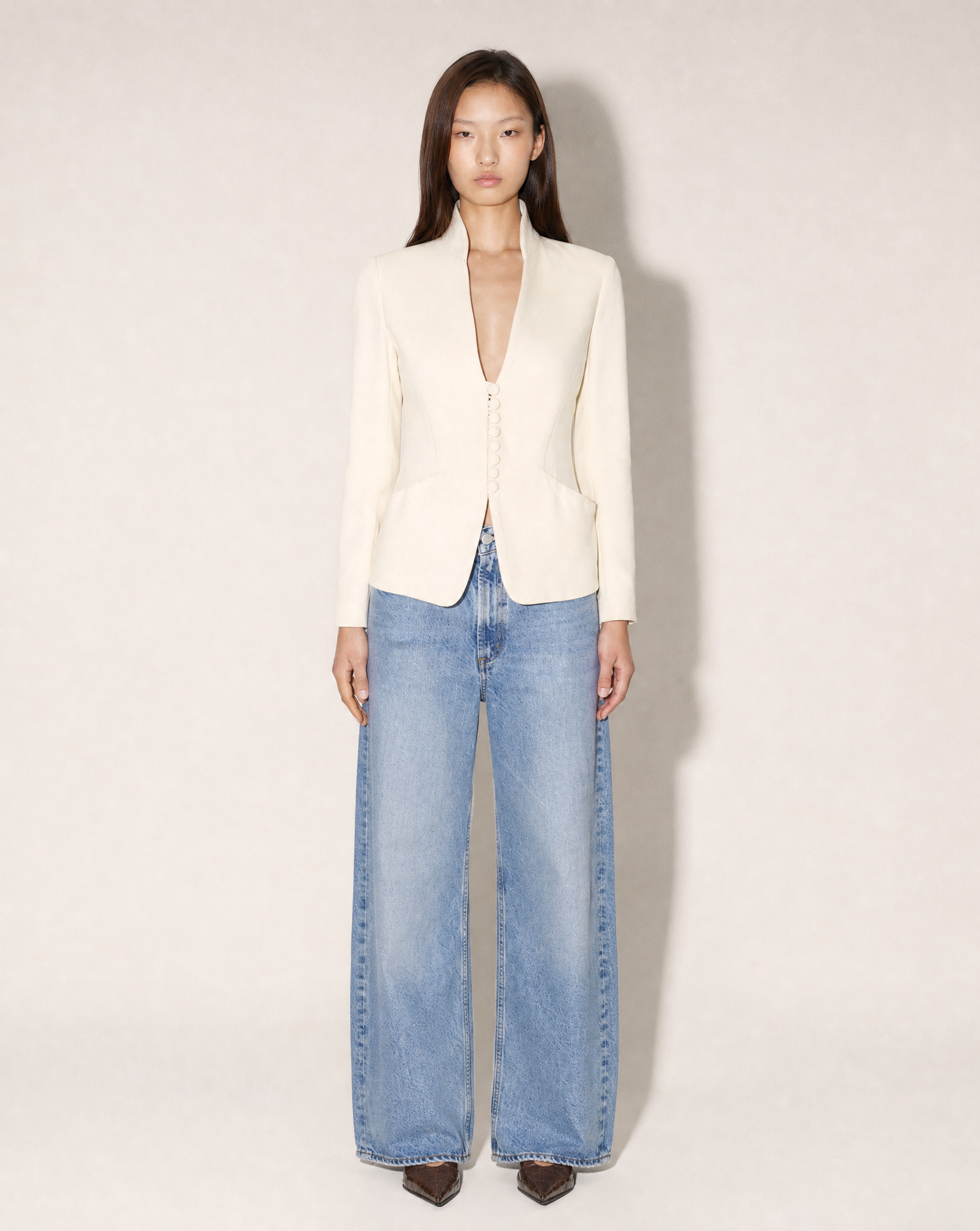 Vintage Giorgio Armani ivory stand-collar tailored blazer with fabric-covered buttons, available for purchase and luxury rental across Europe from Mezzanotte.